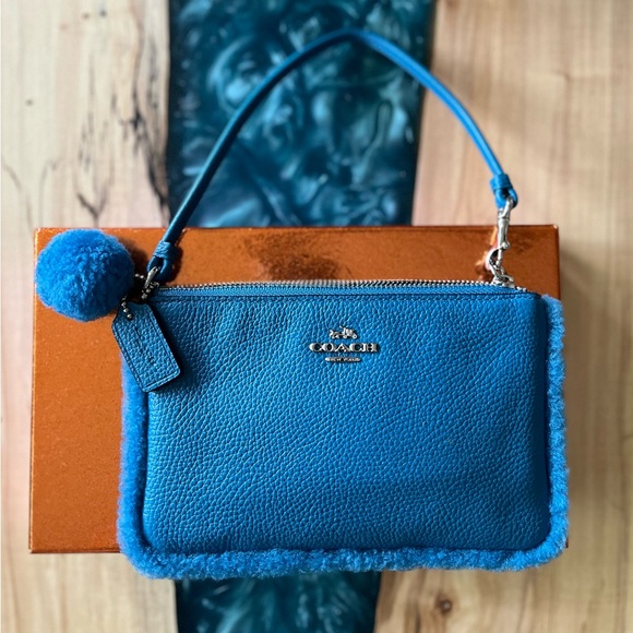 Coach Handbags - Coach NWOT Blue Leather and Shearling Wristlet with box